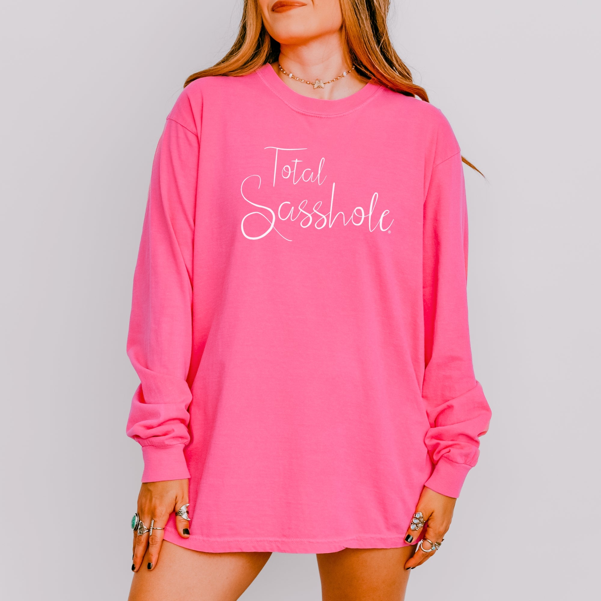 Image of Woman wearing a crunchberry long-sleeve t-shirt with text on a gray background