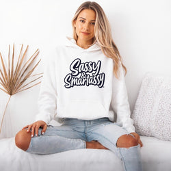 Image of Woman wearing a white hoodie with 'Sassy & Smartassy' text, sitting on a couch.
