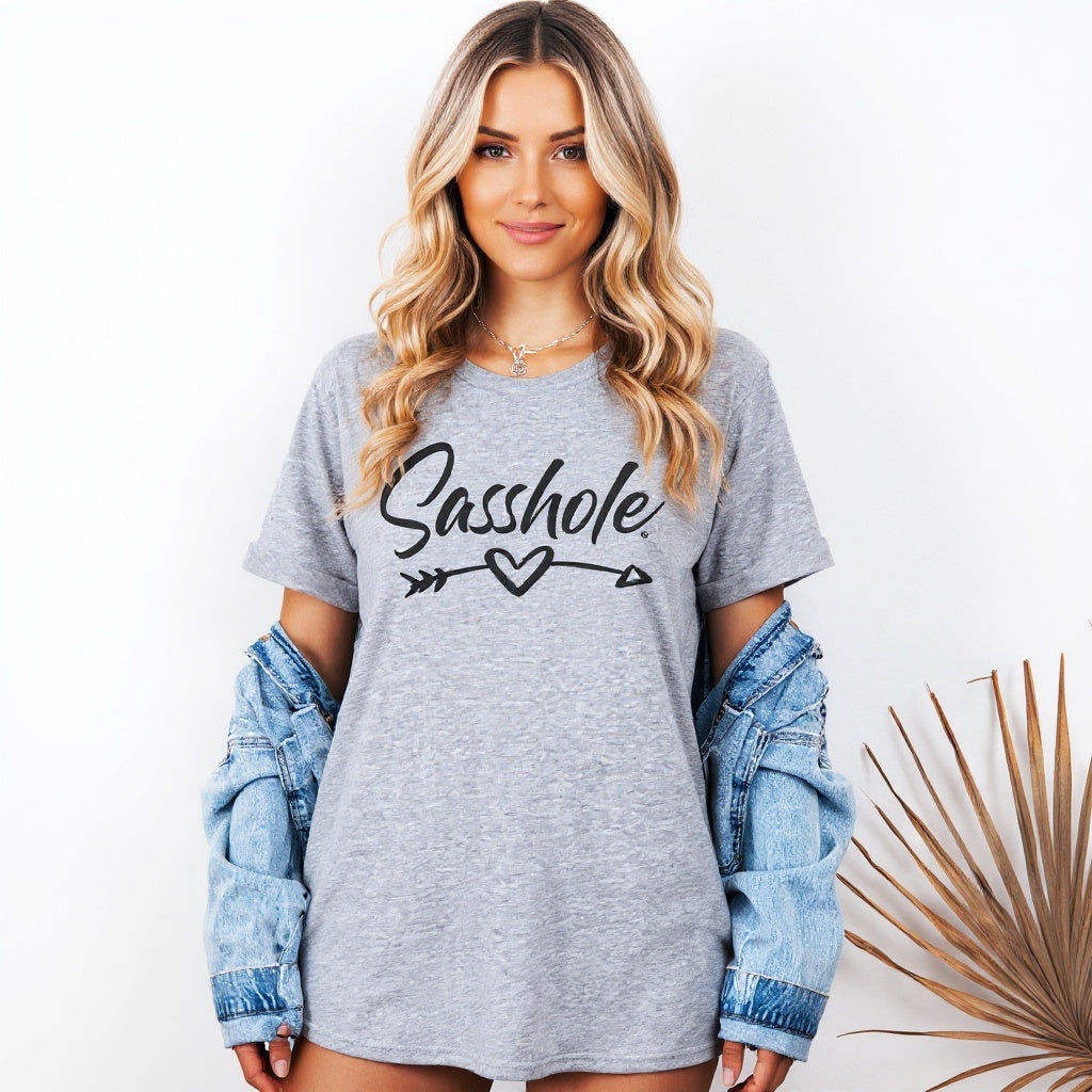 Woman wearing a gray t-shirt with 'Sasshole' text, standing against a white background.