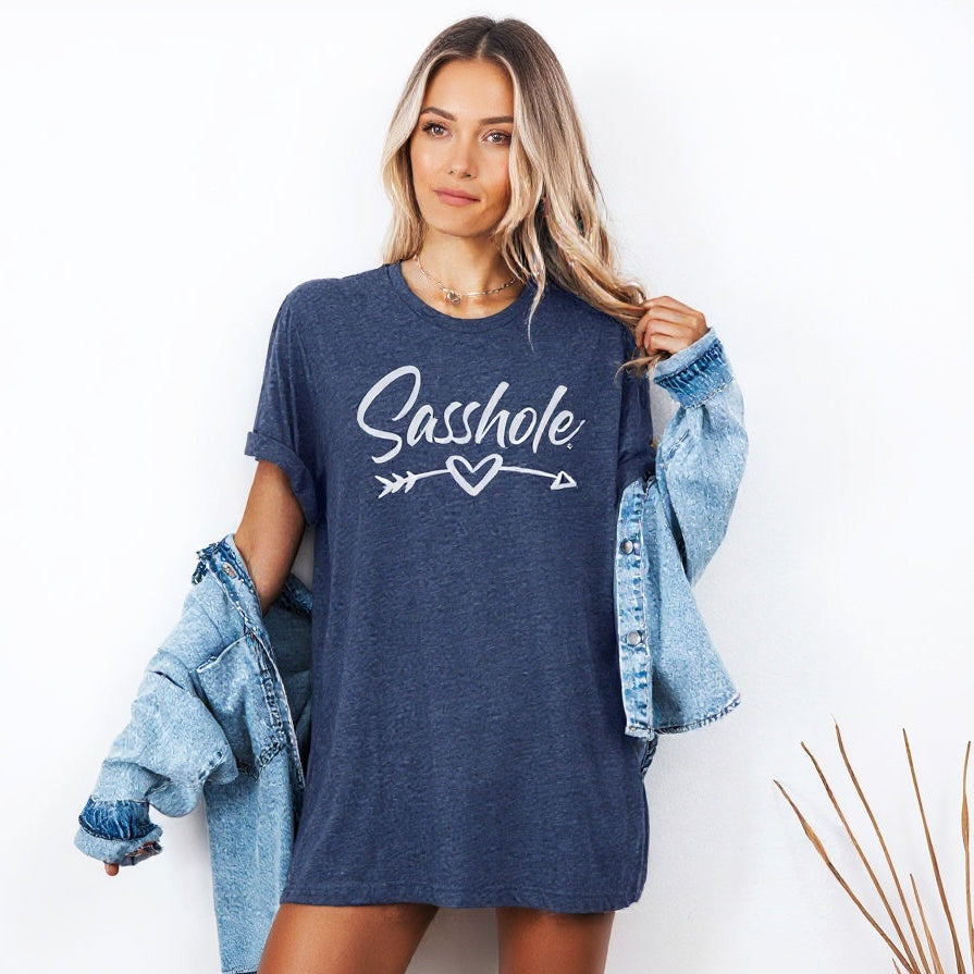 Woman wearing a blue t-shirt with 'Sasshole' graphic design on a white background