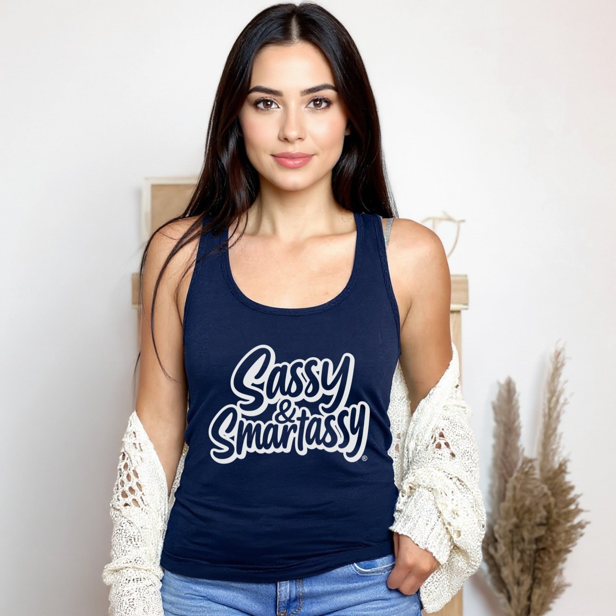 Woman wearing a navy tank top with 'Sassy & Smart Assy' text against a neutral background