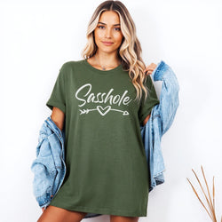 Image of Woman wearing a military green t-shirt with 'Sasshole' text and a heart arrow graphic.