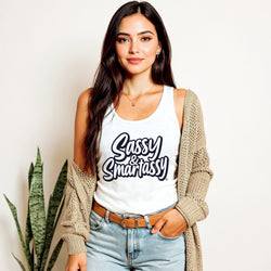 Image of Woman wearing a white tank top with 'Sassy & Smartassy' text, beige cardigan, and blue jeans.